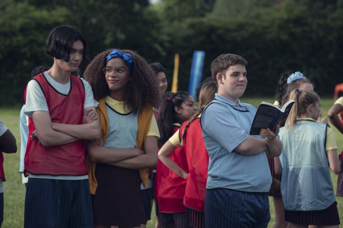 Season 1 Episode 8: R-L Tao Xu (William Gao), Ellie Argent (Yasmin Finney), and Isaac Henderson (Tobie Donovan) at "Sports Day" watching Charlie race