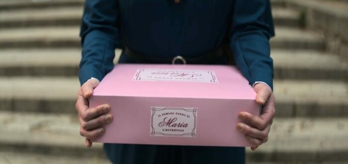 Mrs. Davis S1E4 - Zoom in on the Maria's Bakery box held in Simone's hands