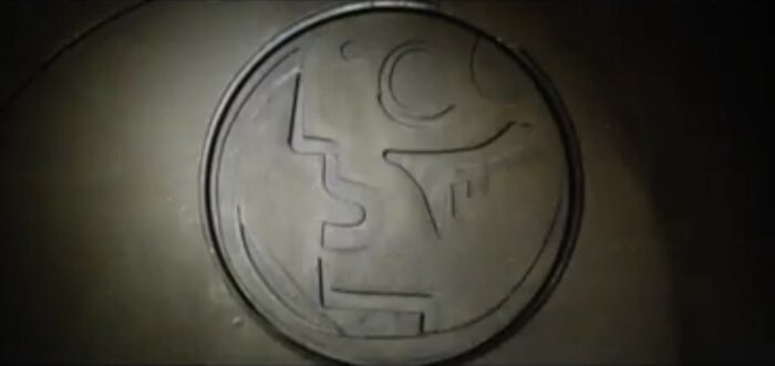 Foundation S2E3 - A symbol is engraved in a circle on a stone wall