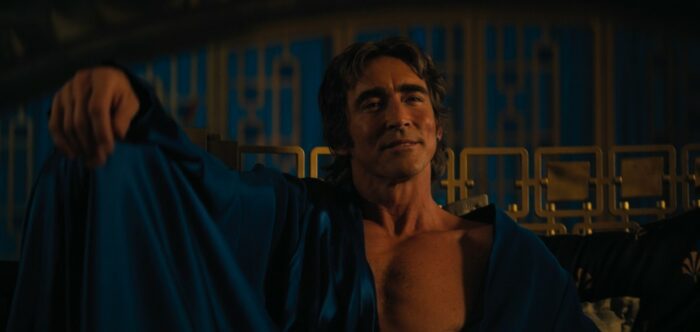 Foundation S2E5 - Brother Day lounges on his bed in a loose blue silk robe