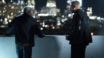 Sweety and Clement stand on a roof in front of the Detroit skyline in Justified: City Primeval Episode 6, "Adios"