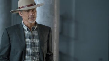 Raylan stands in a hallway, wearing his hat, in Justified: City Primeval Episode 7, "The Smoking Gun"