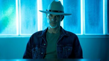 Raylan sits at a table in the Justified: City Primeval finale