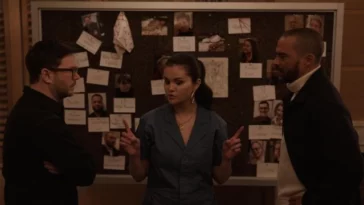 Mabel, Theo, and Tobert discuss in front of the murder board in Only Murders in the Building S3E7, "CoBro"