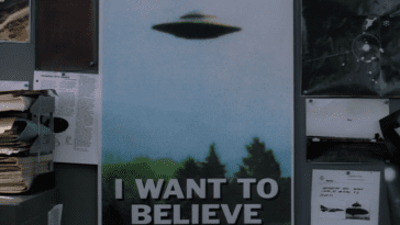 A poster with a flying saucer on it and the words "I Want to Believe"