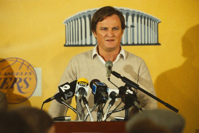 Jerry West stands at the podium during a press conference. 