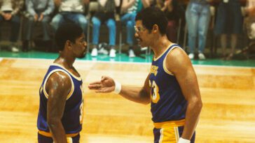 Kareem confronts Magic on the court, pointing a hand towards Magic's chest in the Winning Time finale