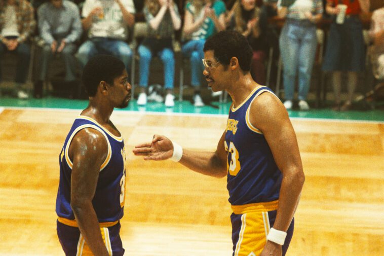 Kareem confronts Magic on the court, pointing a hand towards Magic's chest in the Winning Time finale