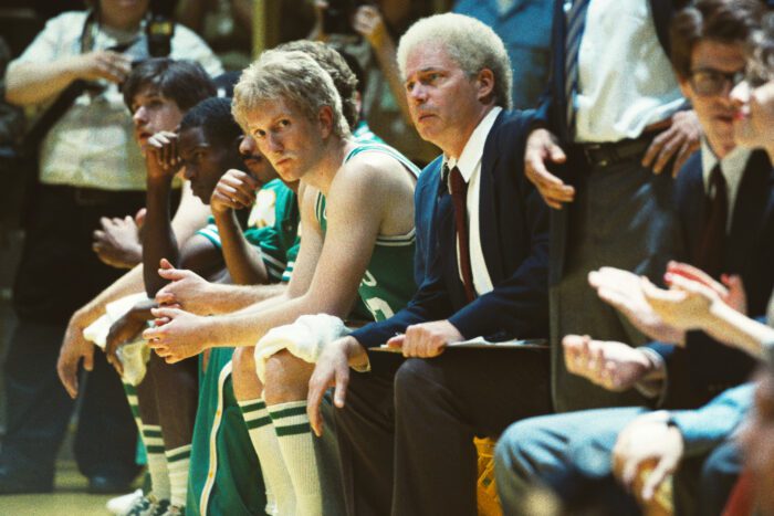 Larry Bird, sitting courtside, glares at the Lakers in the Winning Time finale