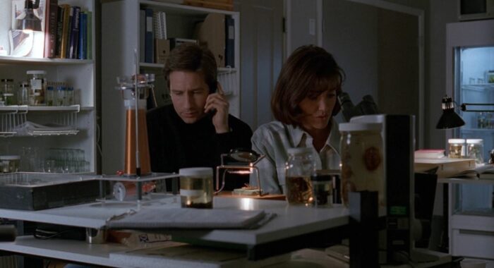 Mulder and Bambi in front of a table in her lab