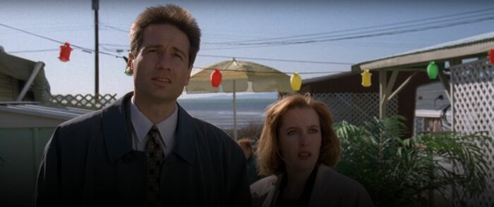 Mulder and Scully look on in The X-Files, "Humbug"