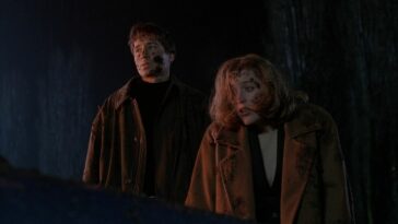 Mulder and Scully wearing jackets, splattered with manure, in "War of the Corprophages"