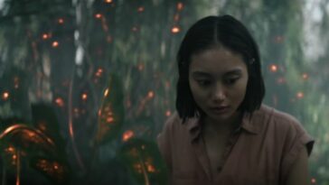 Mitsuki in the forest, with lights around her, in Invasion S2E9, "Breakthrough"