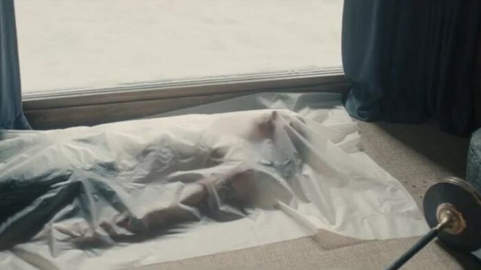 A Murder at the End of the World S1E2 - Bill's body lies on the floor in his hotel room covered by a sheet of plastic