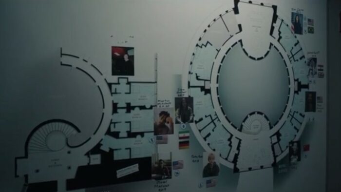 A Murder at the End of the World S1E3 - A whiteboard in the kitchen shows a map of the hotel with the guest rooms indicated on it