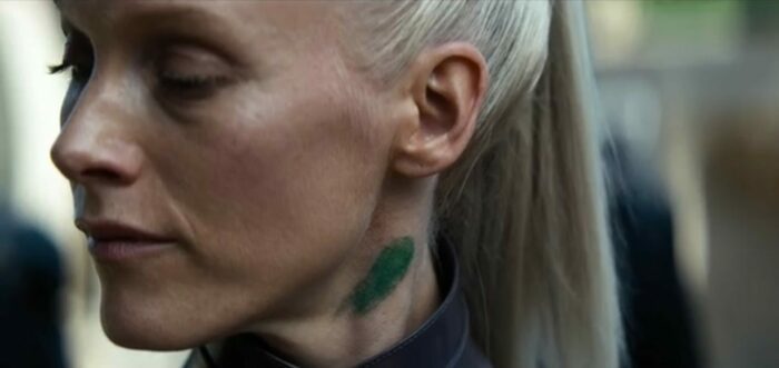 Foundation S2E10 - Demerzel turns her face aside, revealing a green paint smudge on her neck