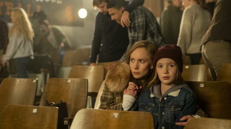 Dorothy holds her daughter, Scott close during a brawl in the Fargo Season 5 premiere