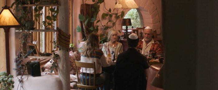 Elizabeth and Paul having dinner with Whitney and Asher, who are seen from behind