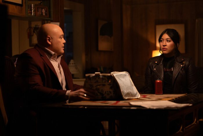 Wilson Fisk and Maya Lopez sit at a table looking at each other in Echo
