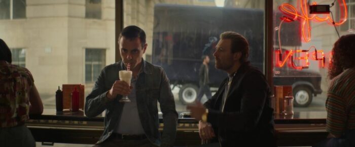 Don drinks a milkshake while Gal looks on