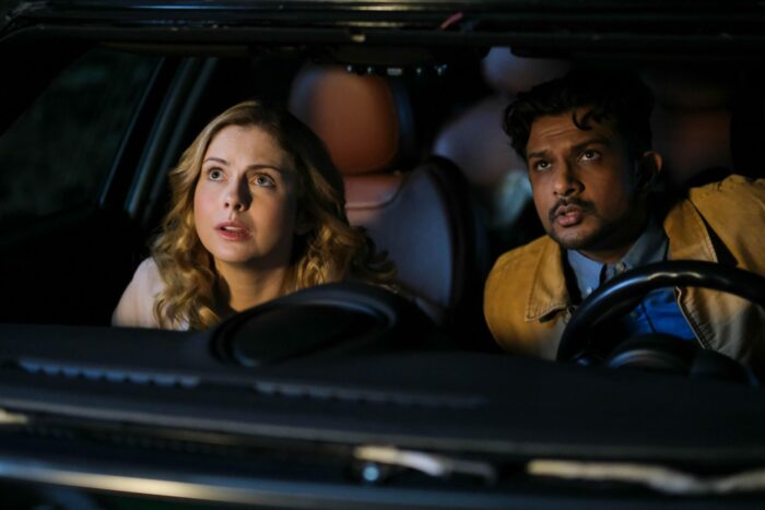 Jay and Sam in a car looking up through the windshield in Ghosts on CBS