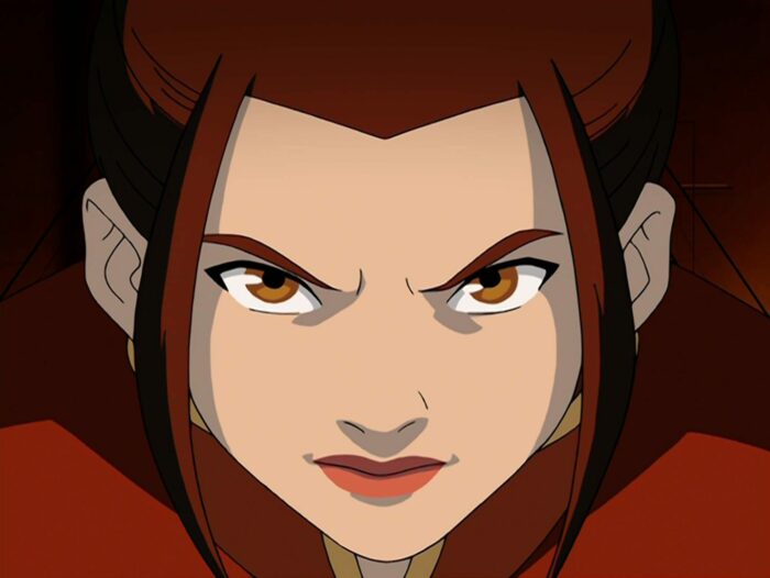 A close up of Azula's face staring intently into the camera