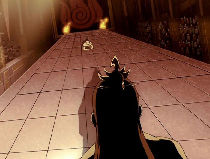 The back of Ozai's head in shadow in the front of the frame towering over Zuko who is bowing on the far side