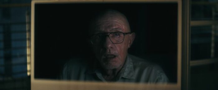 Jonathan Banks in glasses on a computer screen