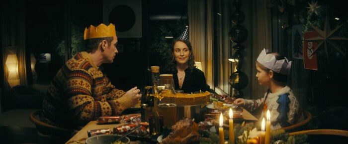 Magnus, Jo, and Alice having a birthday dinner, with silly hats on