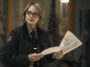 Danvers wears glasses and holds pieces of paper in True Detective: Night Country Part 4